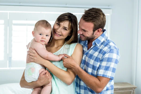 Parents with cute son in bedroom — Stock Photo, Image