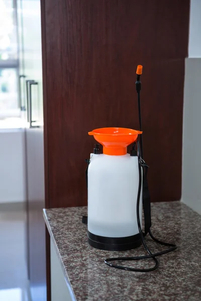 Insecticide sprayer on kitchen worktop — Stock Photo, Image