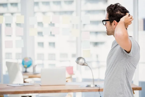 Thoughtful man looking at sticky notes — Stock Photo, Image