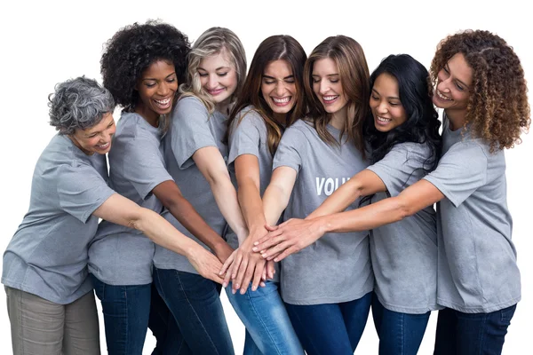 Volunteers putting hands together — Stock Photo, Image