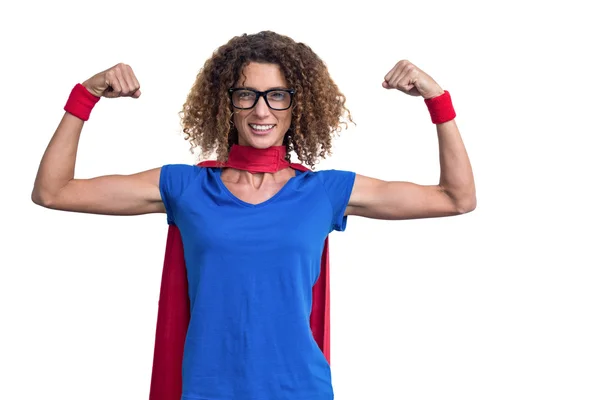 Woman in superhero costume flexing muscles — Stock Photo, Image