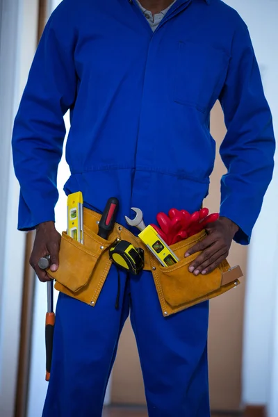 Handy man wearing tool belt — Stock Photo, Image