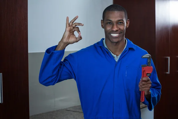 Plumber with wrench showing ok sign — Stock Photo, Image