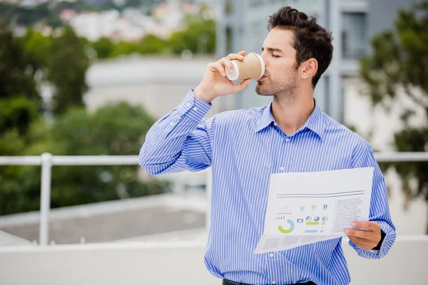 Businessman reading newspaper — Stock Photo, Image