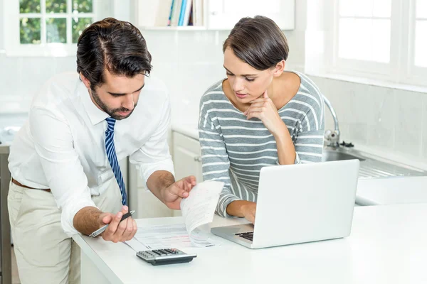 Businessman with woman looking at document — Stock Photo, Image