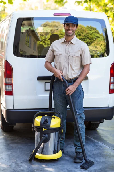 Janitor with vacuum cleaner — Stock Photo, Image