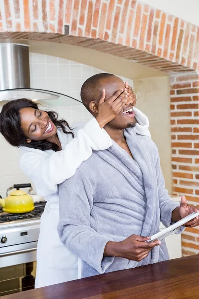 Woman covering mans eyes — Stock Photo, Image