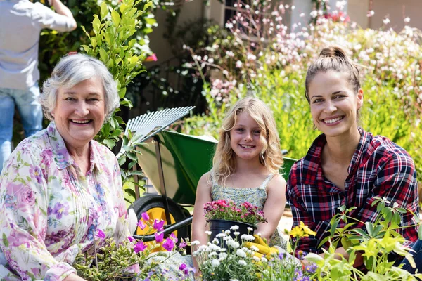 Grandmother, mother and daughter gardening together — Stock Photo, Image