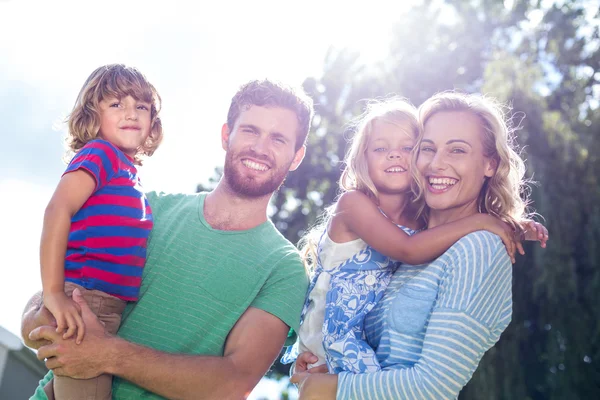 Parents carrying children — Stock Photo, Image