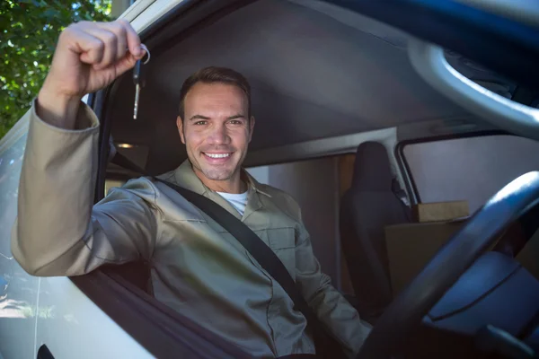 Delivery man sitting in his van — Stock Photo, Image