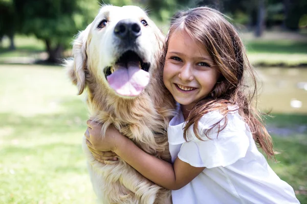Girl with pet dog in park — Stock Photo, Image