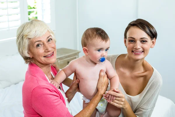 Grandmother and mother with baby boy — Stock Photo, Image