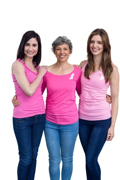 Mujeres sonrientes en trajes rosas posando —  Fotos de Stock