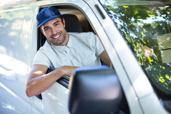 delivery person sitting in van