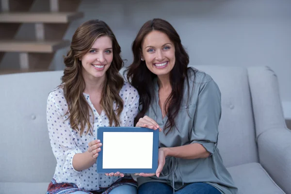 Women holding digital tablet — Stock Photo, Image