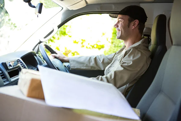 Delivery man driving his van — Stock Photo, Image