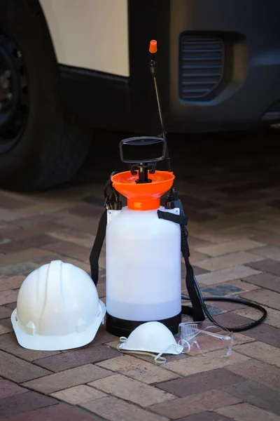 Insecticide sprayer on pavement — Stock Photo, Image