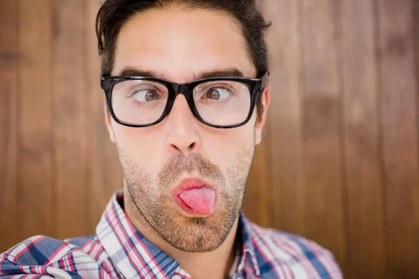 Young man pulling funny faces — Stock Photo, Image