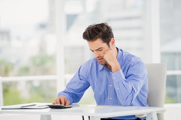 Businessman calculating accounts — Stock Photo, Image