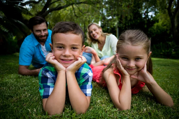 Children lying with head in hands — Stock Photo, Image