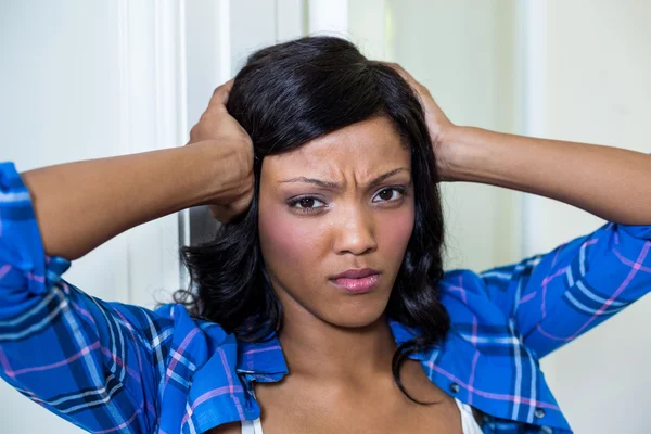 Tensed woman with hand on head — Stock Photo, Image