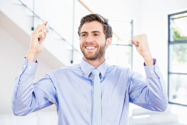Excited businessman in office — Stock Photo, Image