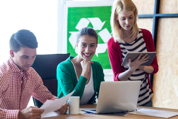 Colleague sitting at their desk — Stock Photo, Image