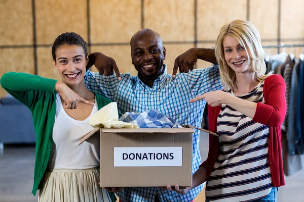 Colleagues holding donation box — Stock Photo, Image