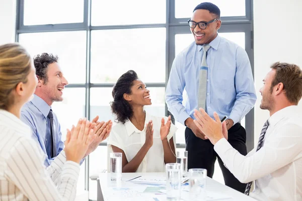 Business team applauding a colleague — Stock Photo, Image