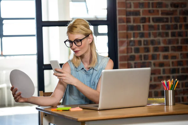 Woman clicking photo of color swatches — Stock Photo, Image