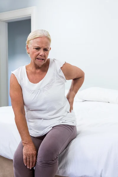 Senior woman suffering from back pain — Stock Photo, Image