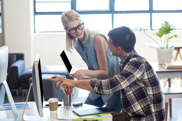 Graphic designer interacting at desk — Stock Photo, Image