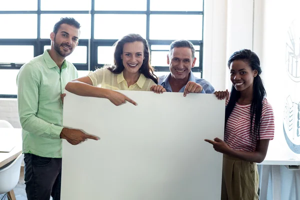 Colleagues holding blank board — Stock Photo, Image