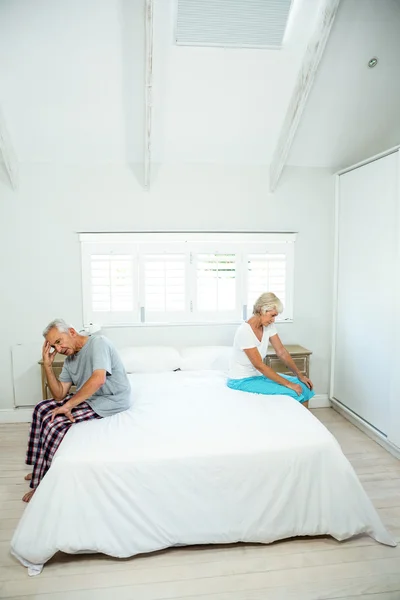 Senior man and woman on bed — Stock Photo, Image