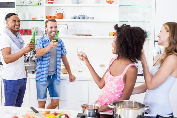 Friends toasting beer and wine — Stock Photo, Image