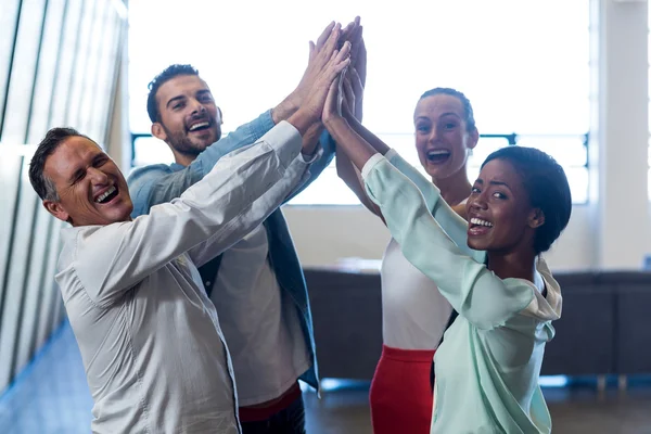 Colleagues doing high five — Stock Photo, Image