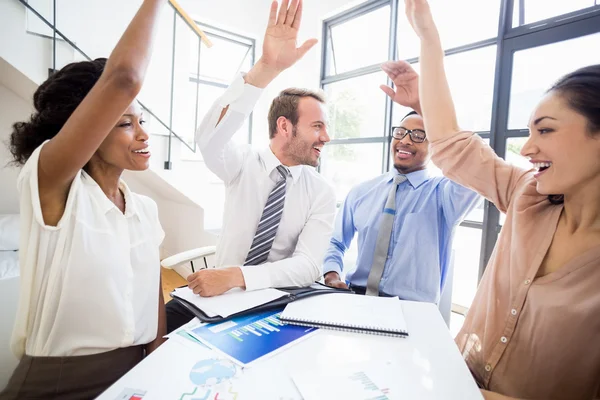 Businesspeople raising their hands — Stock Photo, Image