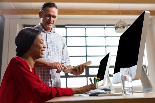 Colleagues looking at tablet — Stock Photo, Image