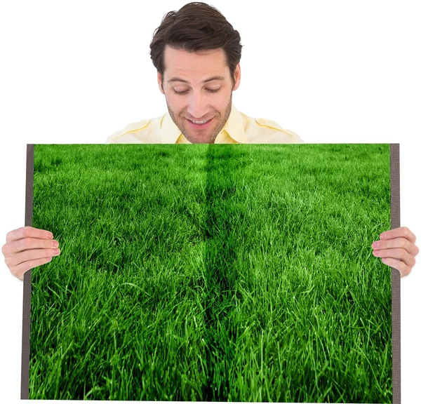 Man holding lawn book — Stock Photo, Image