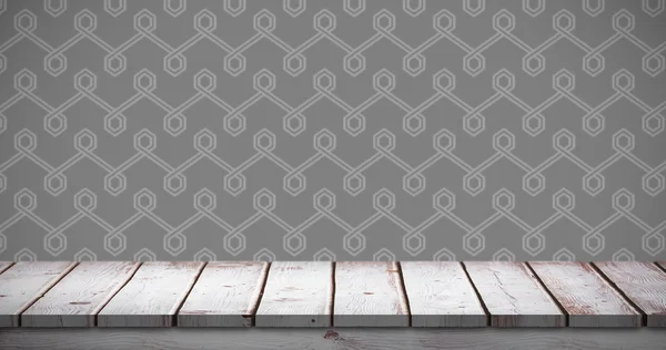 Dřevěný stůl proti šedé pozadí — Stock fotografie