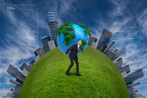 Businessman carrying world — Stock Photo, Image