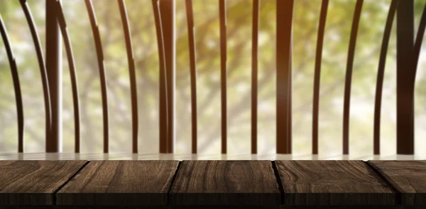 Wooden desk against structure on wood — Stock Photo, Image