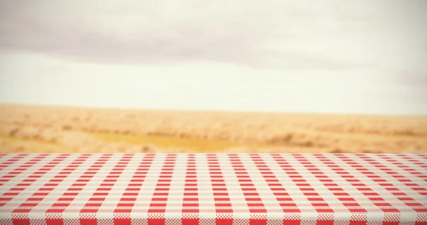 Red and white tablecloth against landscape — Stock Photo, Image