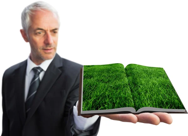 Man showing lawn book — Stock Photo, Image