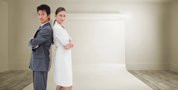 Business people standing back-to-back — Stock Photo, Image