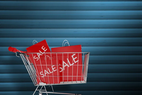 Trolley with sale shopping bags — Stock Photo, Image