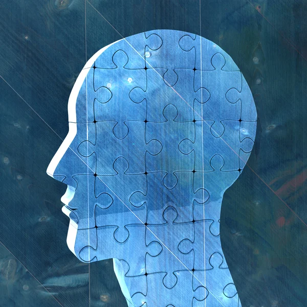 Head made of jigsaw pieces — Stock Photo, Image