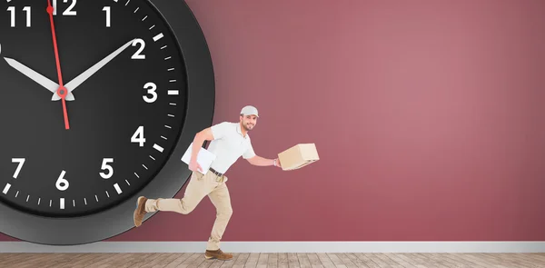 Delivery man with cardboard box running — Stock Photo, Image