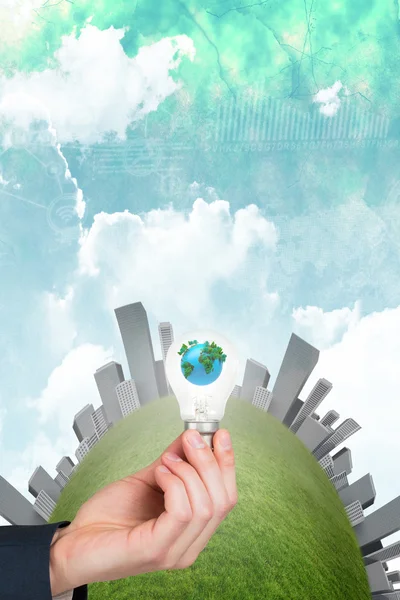 Hand holding environmental light bulb — Stock Photo, Image