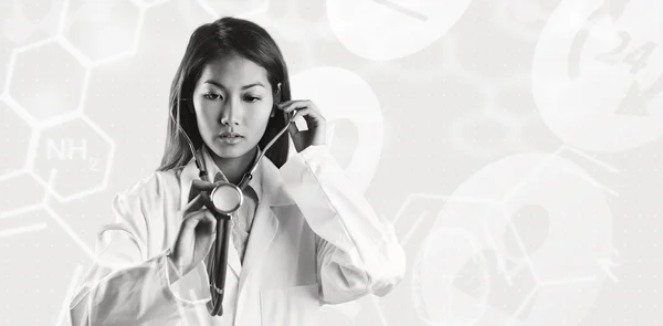 Asian doctor holding stethoscope — Stock Photo, Image